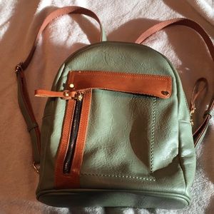 Green and tan back pack purse